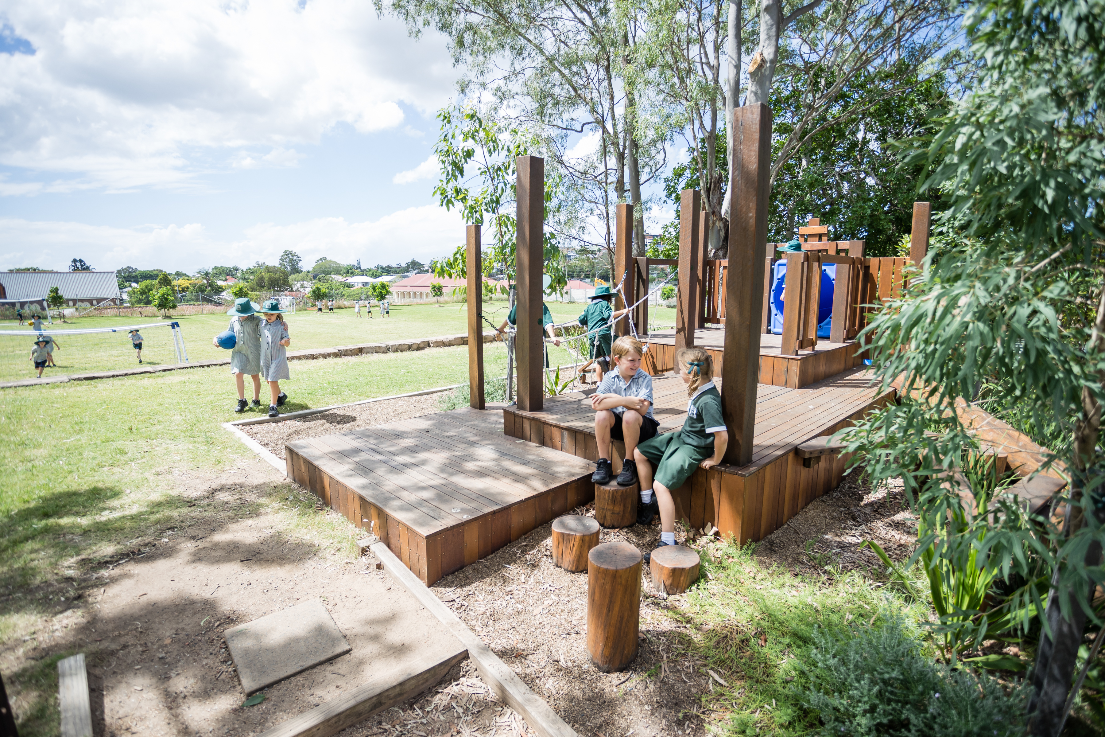 view across playground equipment to school oval